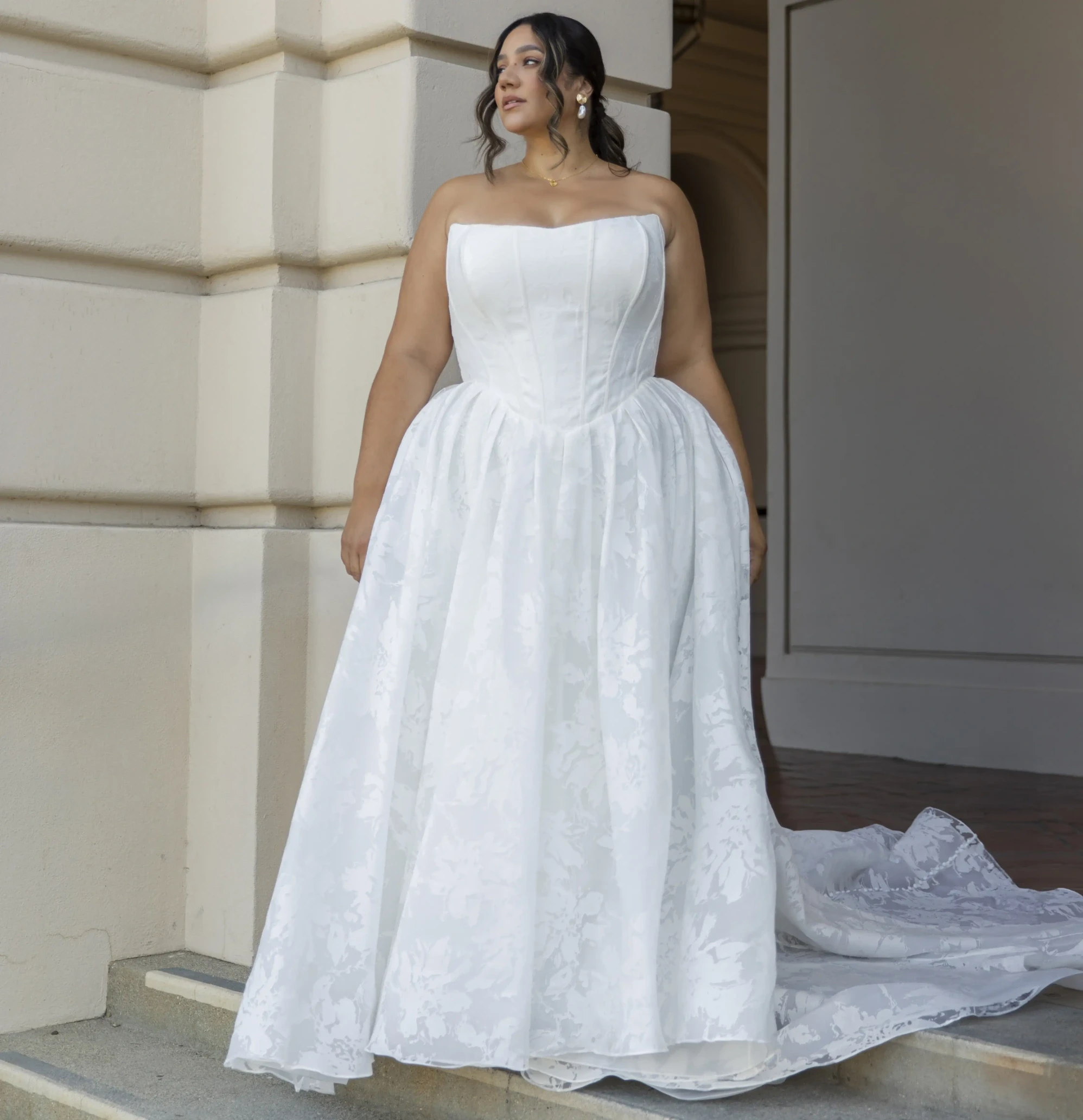 Model wearing a white gown by Essense of Australia